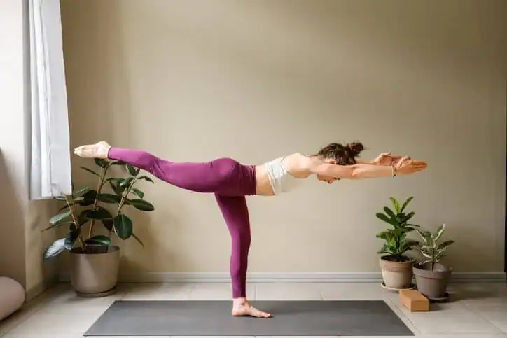 Woman doing Yoga exercise Windlesham to help with toning the body. 