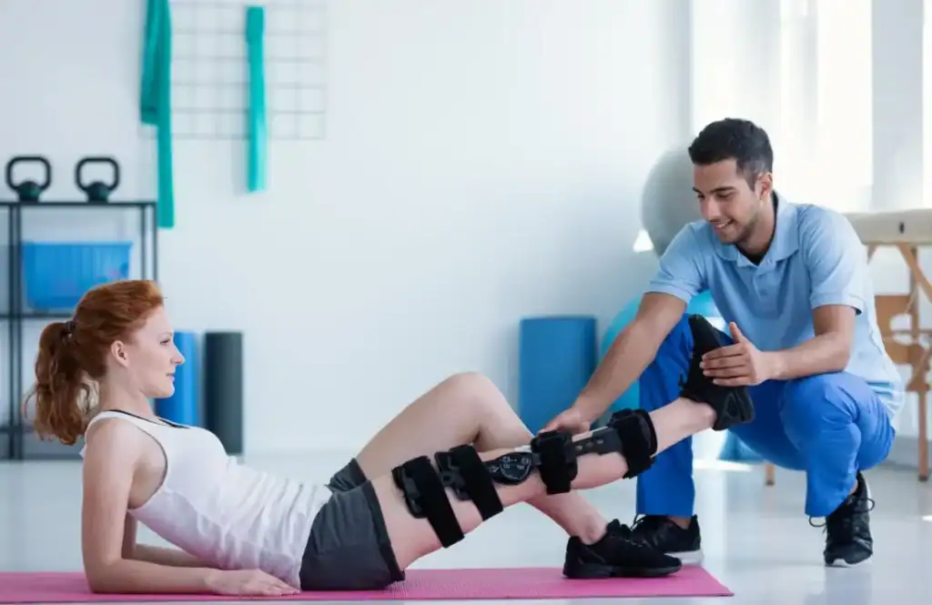 Woman having treatment to help muscle recovery Windlesham after an injury
