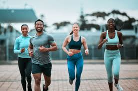 Sculpting Sleek Arms: The Essential Role of Cardio in Toning Without Bulking Up 3 image of people running to incorporate cardio Windlesham exercise into their life to help tone arms and body.