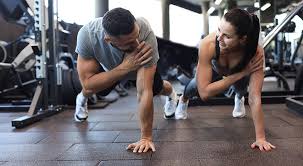 Sculpting Sleek Arms: The Essential Role of Cardio in Toning Without Bulking Up 1 Image of man and woman doing Cardio Windlesham to tone their arms.
